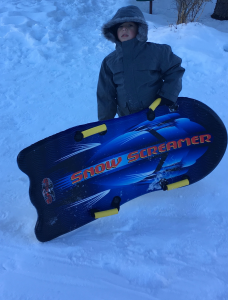 Xavier is serious about his sledding... 