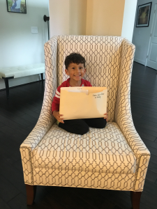 Xavier's always excited to present his school work when he gets home!